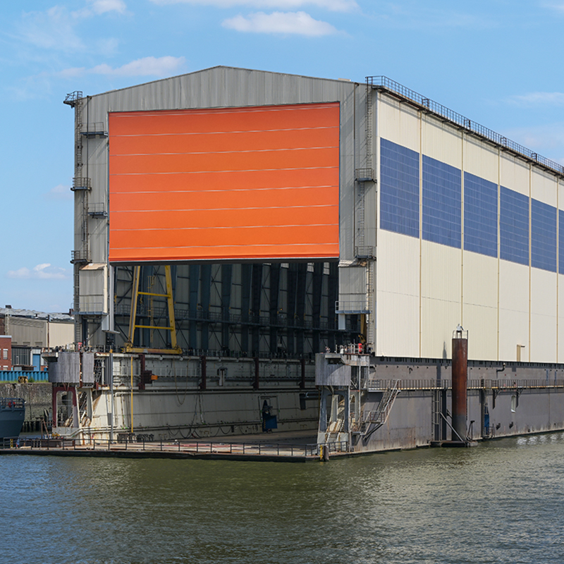 Marine industrial door system for shipbuilding facilities